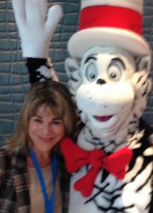 Judi greets her buddy, the Cat in the Hat, aboard Carnival Horizon