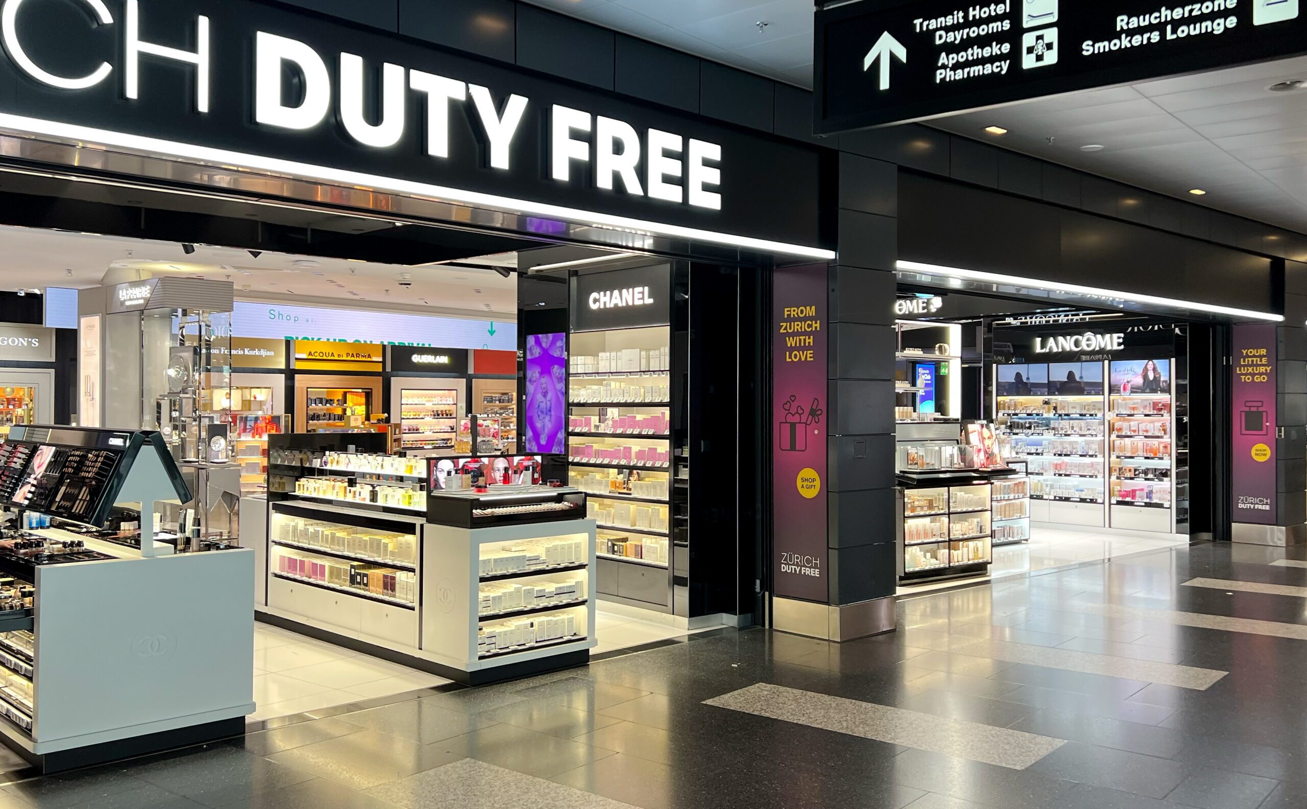 Airport duty free cosmetics store display with luxury beauty brands for travelers