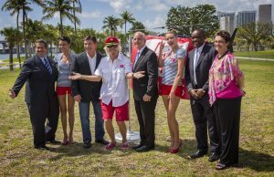 Richard Branson next to Miami Mayor with his tie at the Virgin Cruises announcement. 