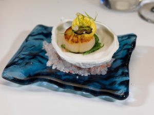 A seared scallop amuse-bouche