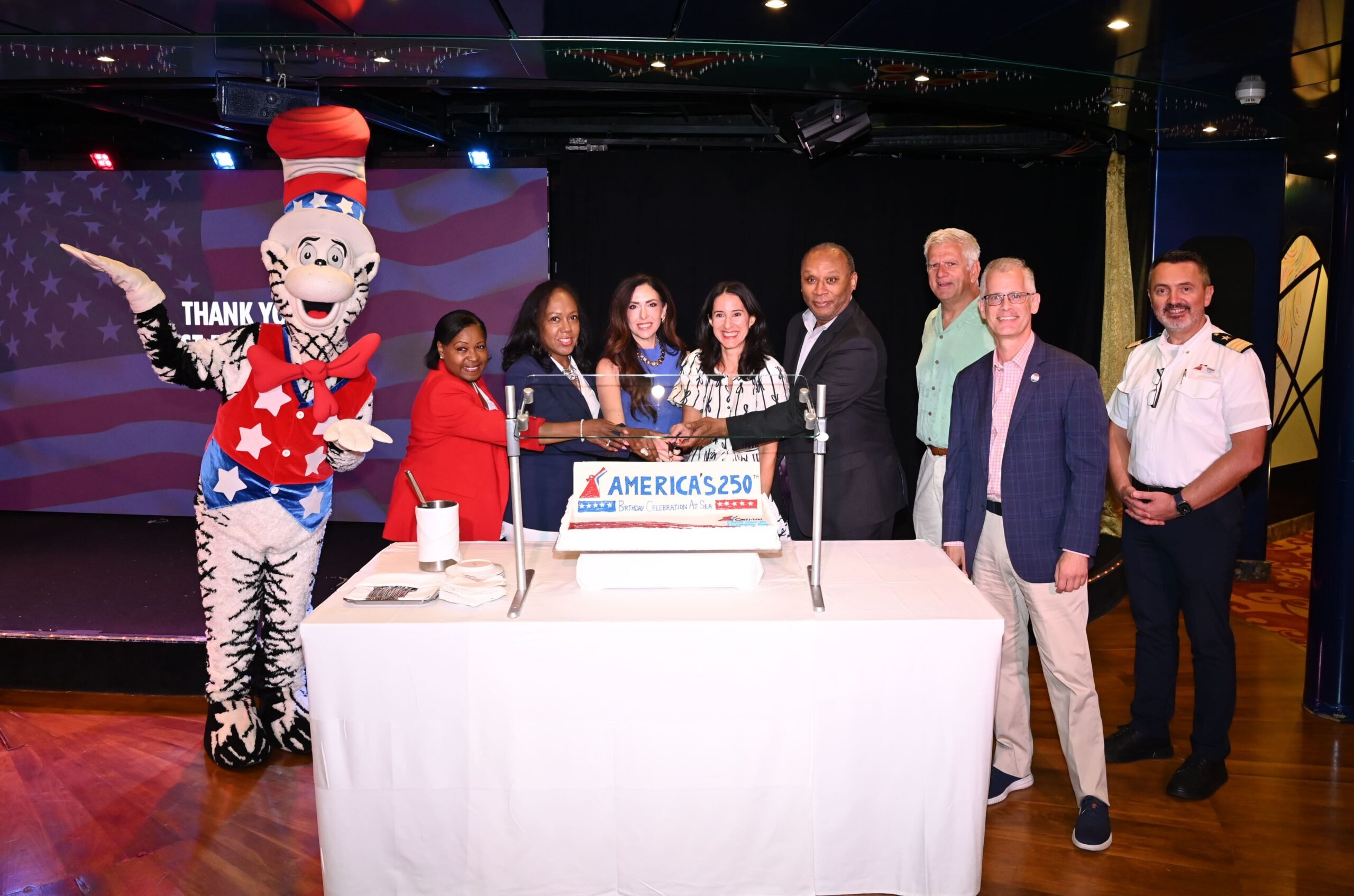 Carnival Cruise Line leaders, port partners and city officials cut cake during America's 250th anniversary
